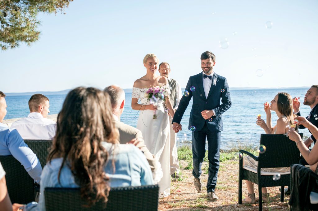 bride and groom at wedding ceremony on beach