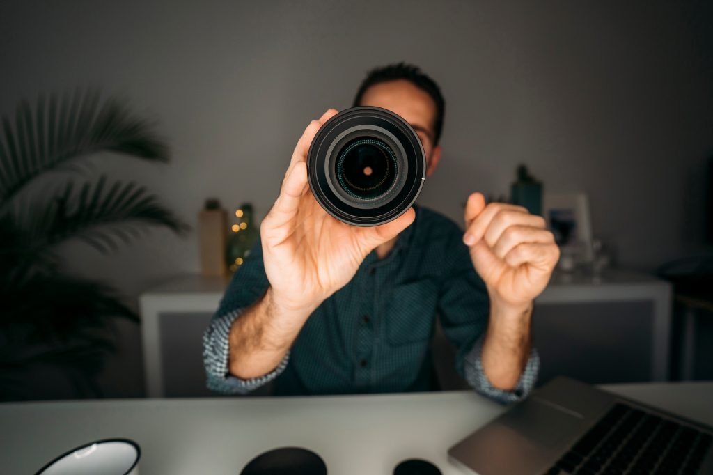 vlogger showing lens during filming