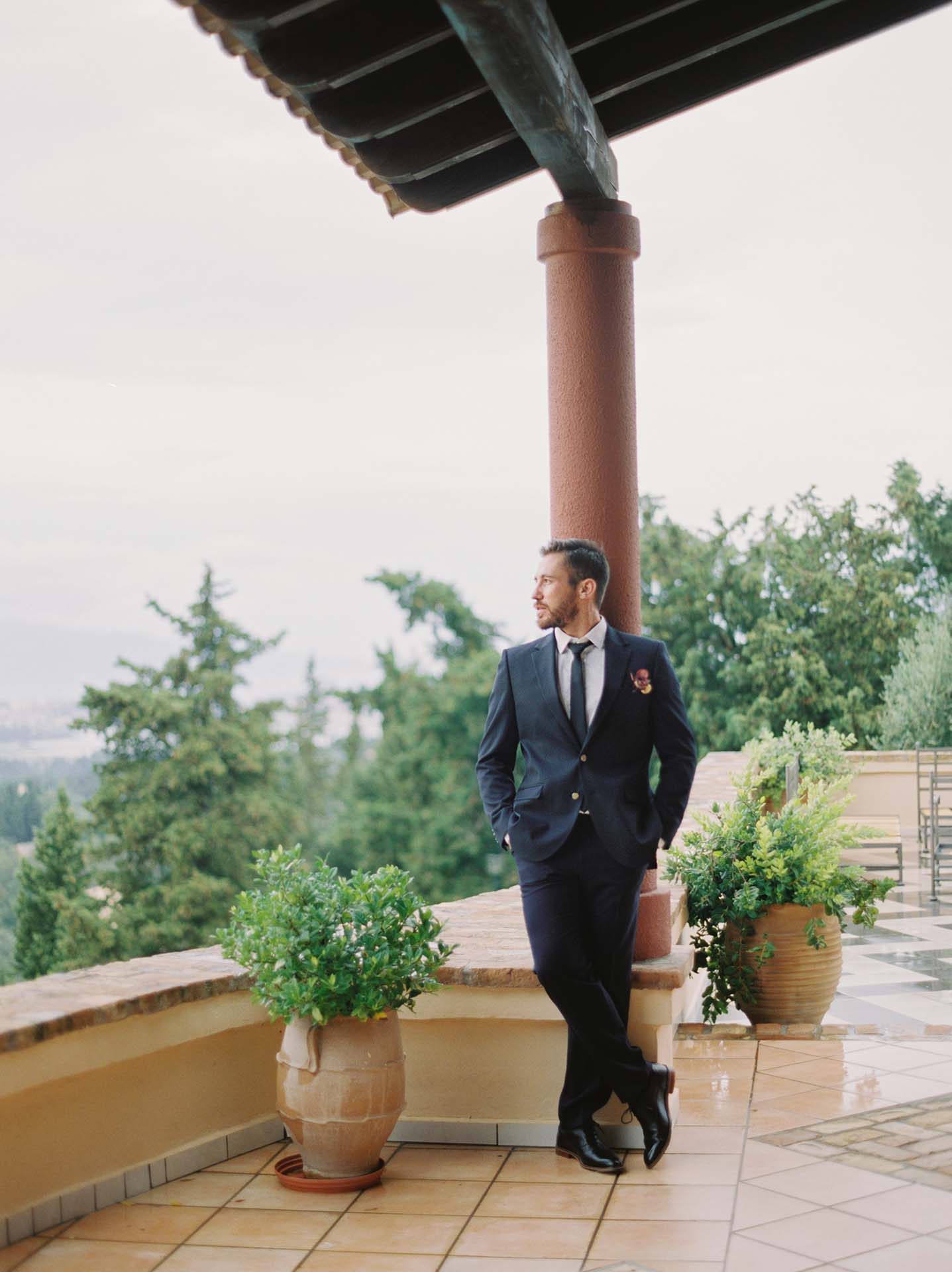 portrait of handsome groom on terrace
